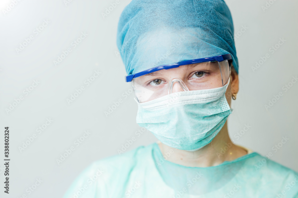 young intern girl in a medical uniform and glasses. portrait of a doctor. young intern girl in a medical uniform and glasses. portrait of a doctor.
