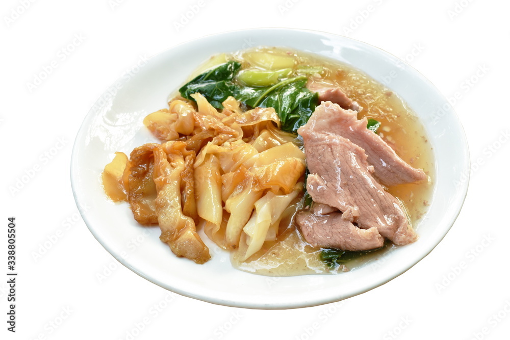 stir fried rice noodles with slice fermenting pork and Chinese kale in gravy sauce on plate