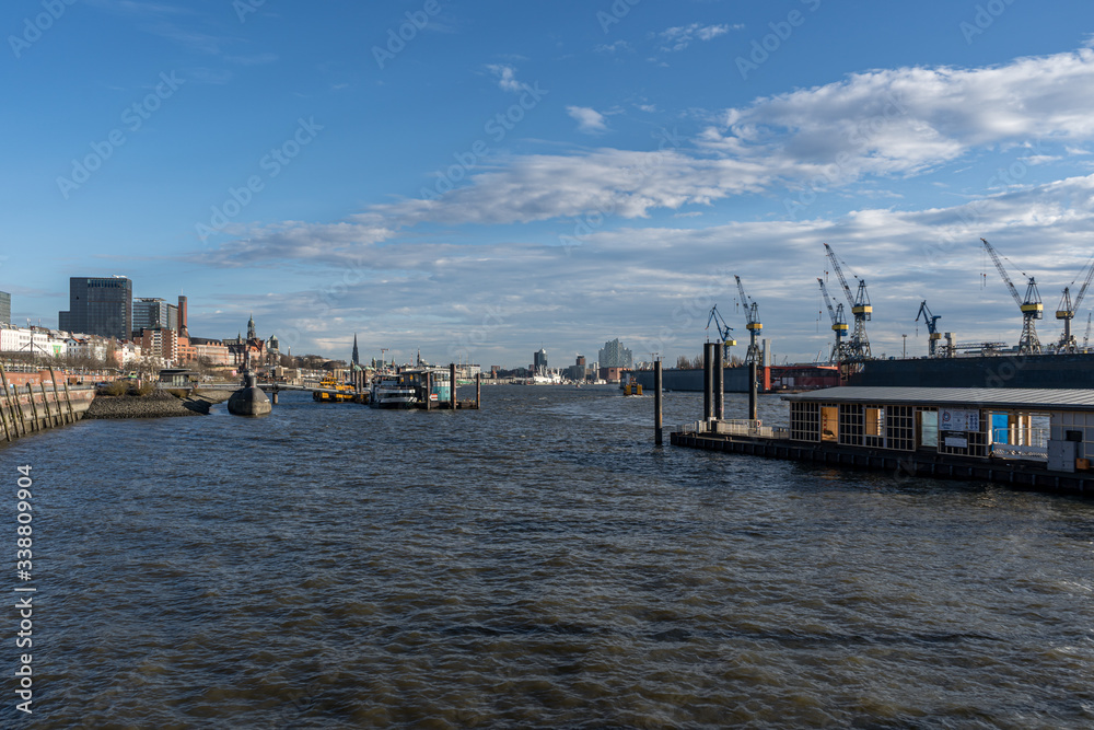 Stunning panoramic view of the Port of Hamburg towards the submarine with some cranes and ships