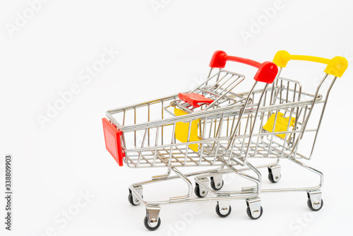 Metal trolley for supermarket. Transportation of products in store. Retail.