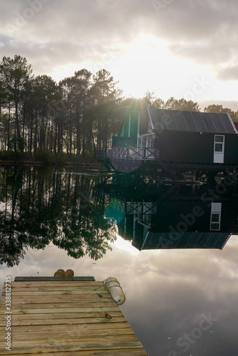 sunrise on wooden pontoon lake in Marina of Talaris in Lacanau village photo