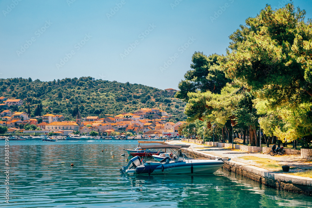 Fototapeta premium Adriatic sea and historic town Trogir at summer in Trogir, Croatia