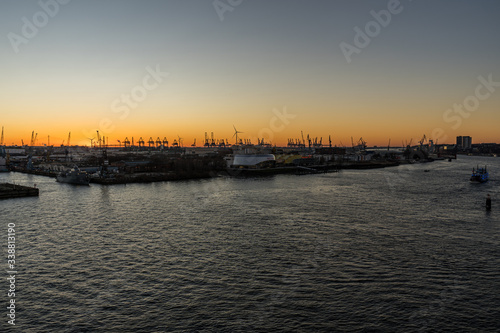 Panoramic view of the Port of Hamburg in the Hafen City at Elbe river at sunset/twilight © kfritsch_69
