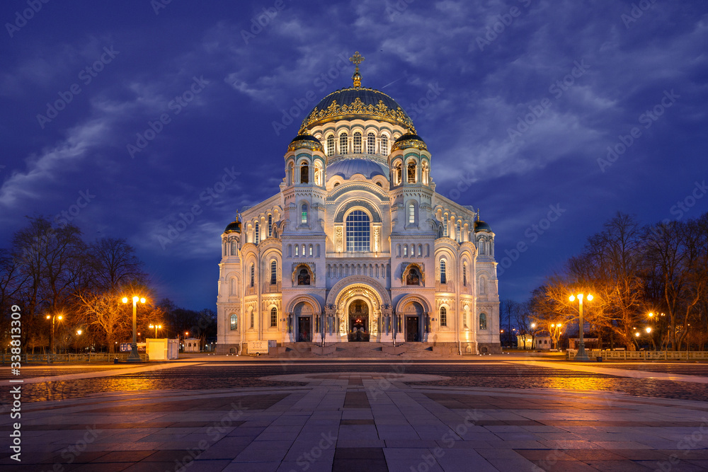 Naval Cathedral in Kronstadt. The best sunset of the evening city. Illumination of the building. Square and evening lights. Traveling in Russia