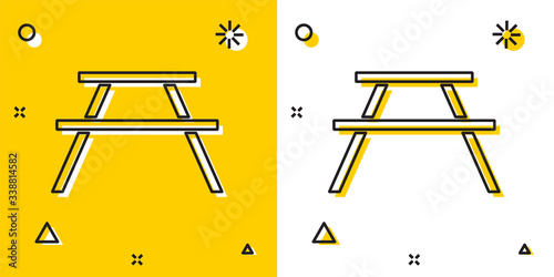 Black Picnic table with benches on either side of the table icon isolated on yellow and white background. Random dynamic shapes. Vector Illustration