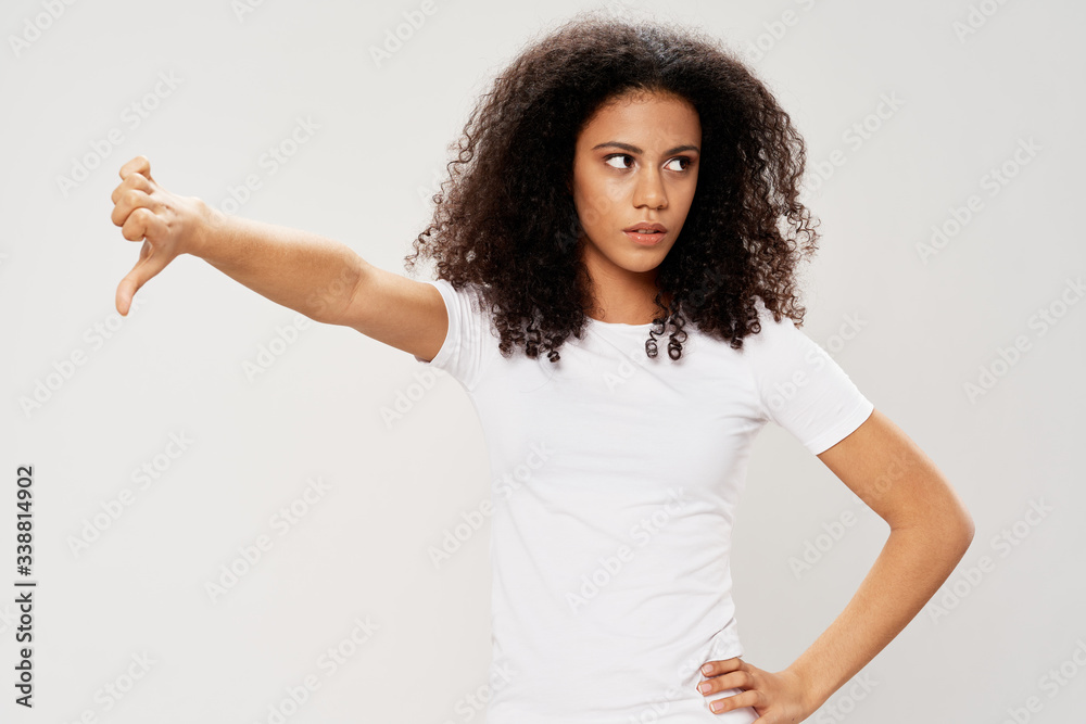 young woman pointing at something young woman pointing at something