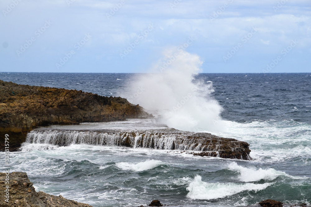 Guadeloupe, waves on rocks.