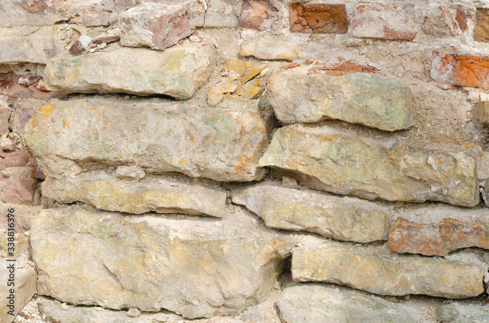 Background of the stone wall of an ancient cave Background of the stone wall of an ancient cave