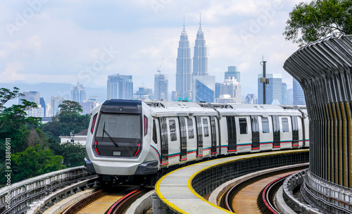 Canvas Print Malaysia Mass Rapid Transit (MRT) train with a background of Kuala Lumpur cityscape