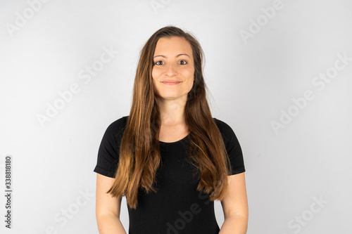 Young woman happy in black shirt with long hair