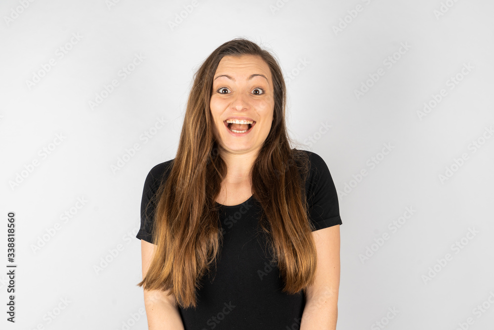 Young woman smiling in black shirt with long hair Young woman smiling in black shirt with long hair