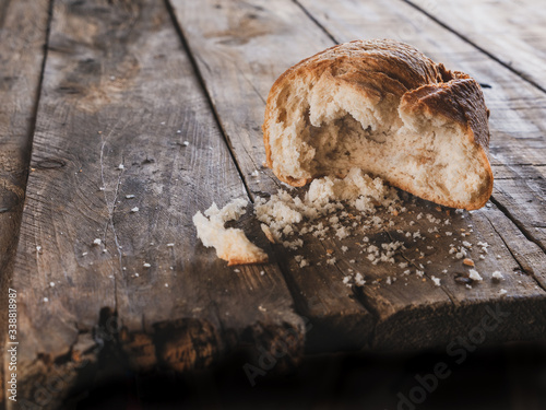 bitten bread roll on an old piece of wood