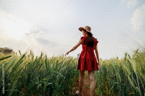 thai tourist female walking alone in barley field farm