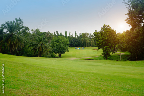 Background of evening golf course has sunlight shining down at golf course in Thailand