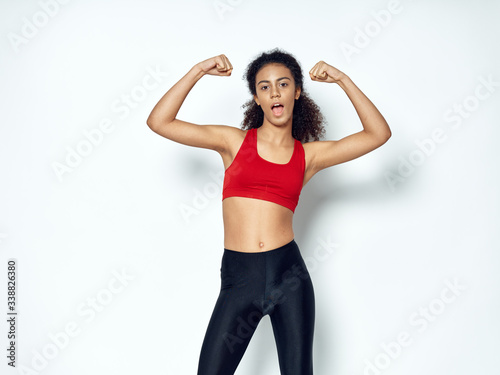 young woman exercising with dumbbells