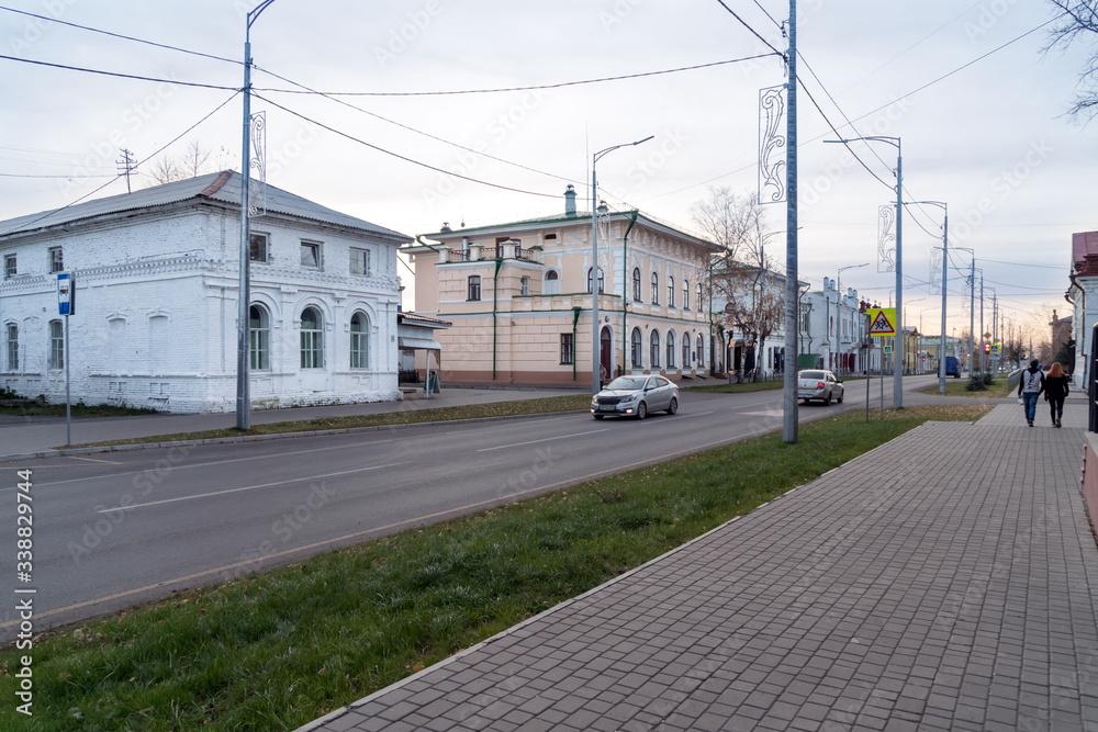 Central Lenin Street with old houses in the evening in the historic center of Yeniseysk. Krasnoyarsk region. Russia.
