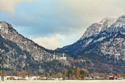 beautiful white Neuschwanstein castle in the Alps mountains