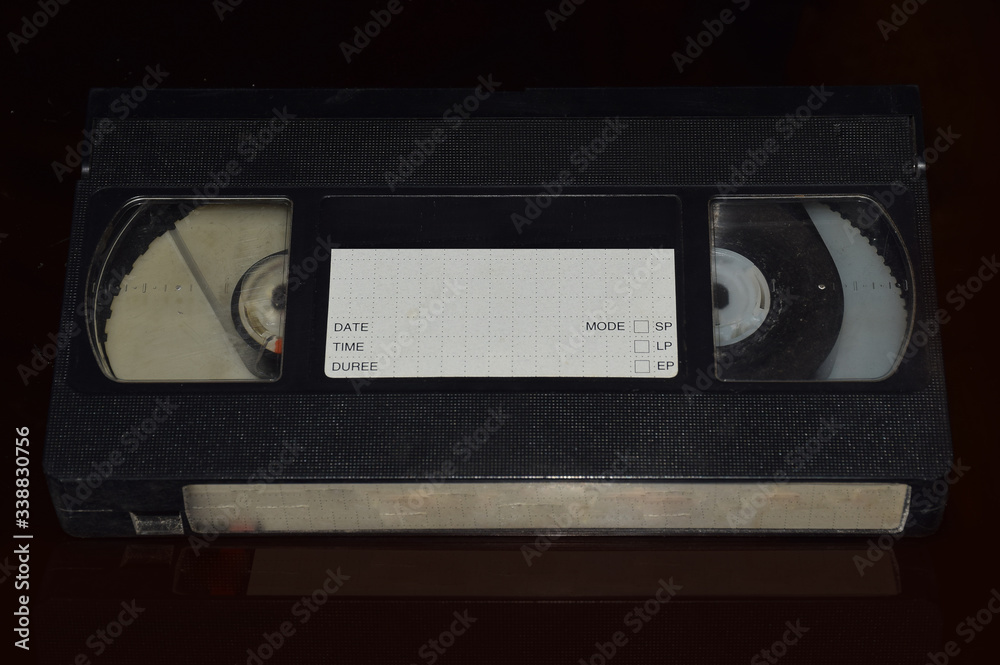 Fototapeta premium Vintage VHS or Video Cassette or tape isolated in black background 