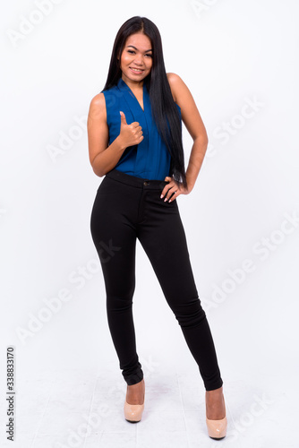 Full body shot of young Asian businesswoman © Ranta Images