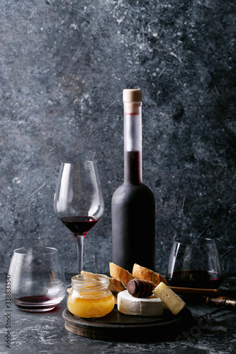 Glass of red wine served with cheese