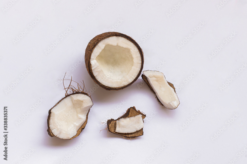 Pieces of coconut on white background, top view. Pieces of coconut on white background, top view.