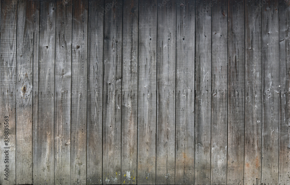 Old boards, a wooden peeled wall of brown color Old boards, a wooden peeled wall of brown color