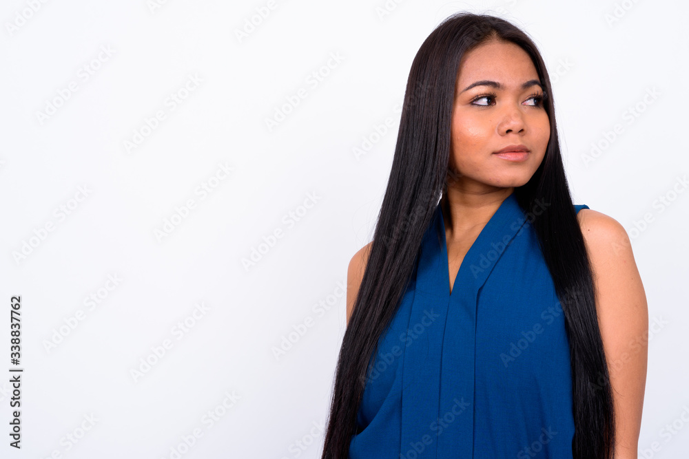 Fototapeta premium Portrait of young Asian businesswoman thinking and looking away