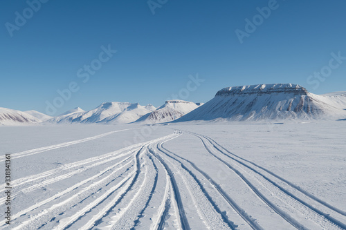 Arctic's landscape snowmobile tracks view 