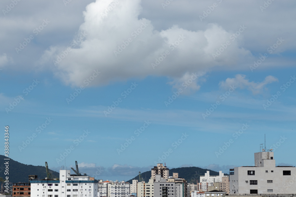 city with blue sky and cloud
