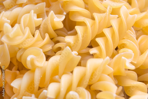 Fusilli. Pasta background. Dry pasta fusilli.