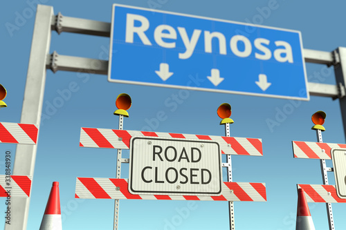 Road barricades near Reynosa city road sign. Coronavirus disease quarantine or lockdown in Mexico conceptual 3D rendering © Alexey Novikov
