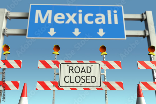 Barriers near Mexicali city traffic sign. Lockdown in Mexico conceptual 3D rendering © Alexey Novikov