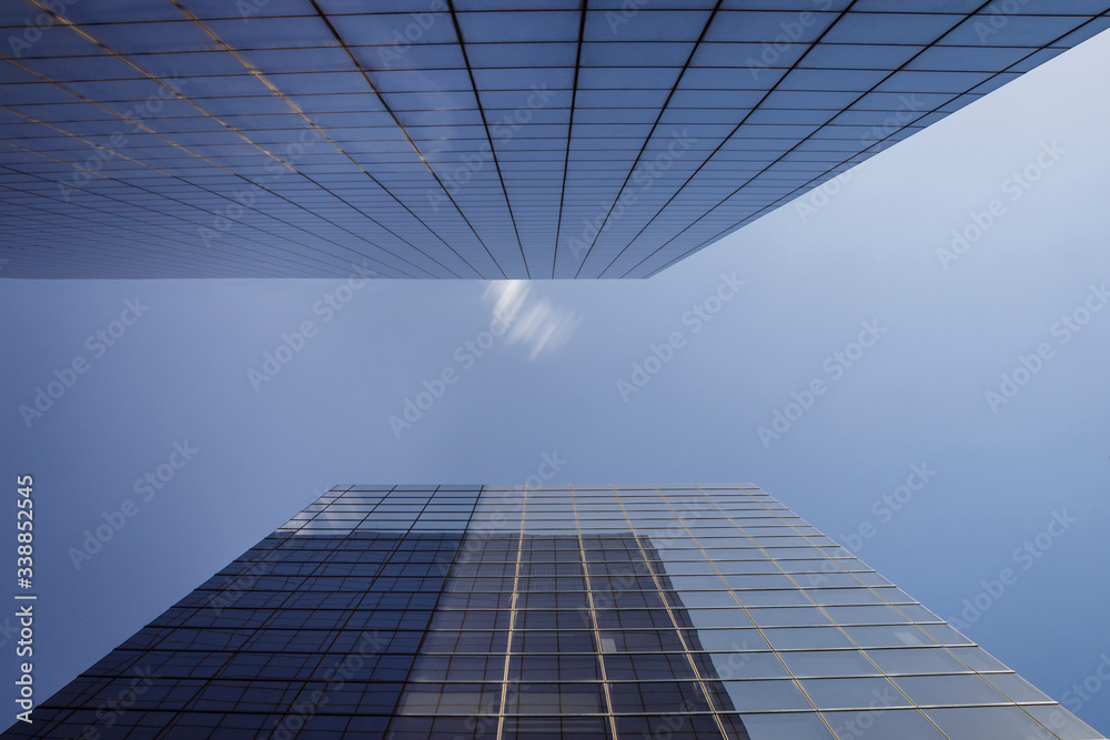 Fototapeta premium Two business towers with some clouds