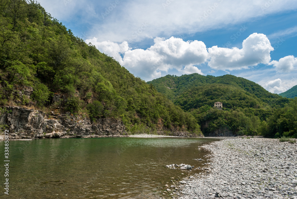 The river Trebbia and the surrounding hills during the summer (Emilia Romagna, Italy) The river Trebbia and the surrounding hills during the summer (Emilia Romagna, Italy)