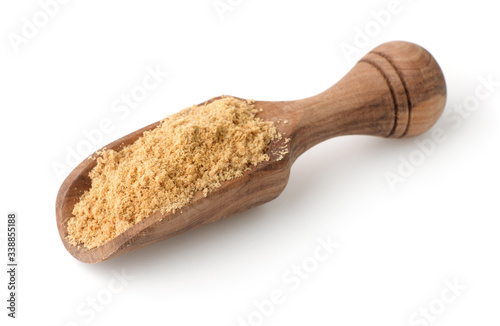 Wooden scoop of dry mustard powder