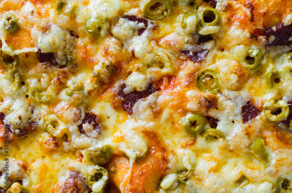 Pizza texture. Freshly baked appetizing pizza. Food background. Pizza texture. Freshly baked appetizing pizza. Food background.