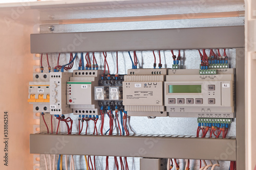 The remote control controller, power supply unit, intermediate relays, phase and voltage monitoring relays, and circuit breaker are arranged in a row in the electrical Cabinet. Assembly, maintenance.