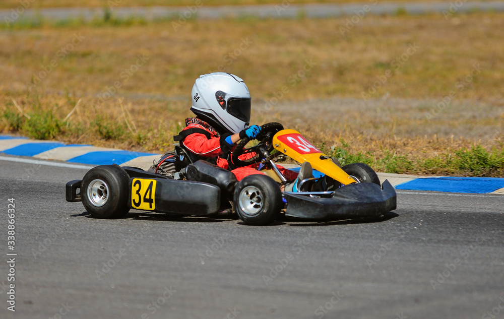 Young go cart racer on circuit