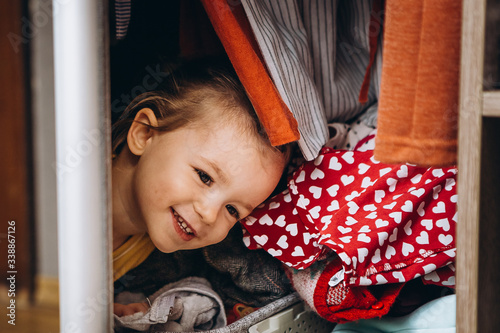 Canvas Print Portrait of happy smiling girl at home