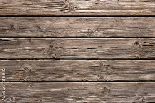 Dark wooden background texture. Old fence panels with natural patterns.