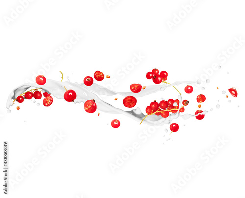 Whole and sliced red currants with milk splashes