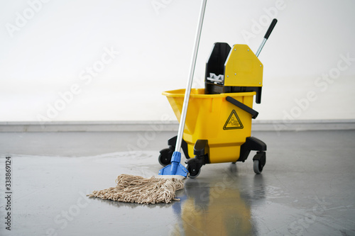 Mop and bucket, janitorial service.
