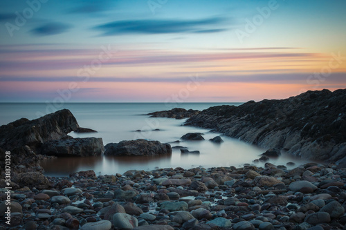 Golden hour sunset at low tide at Duck Pond Beach. Long exposure.