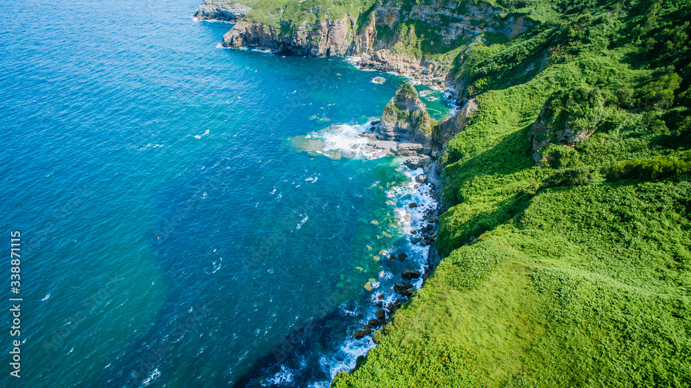 Aerial view of green coast line Aerial view of green coast line