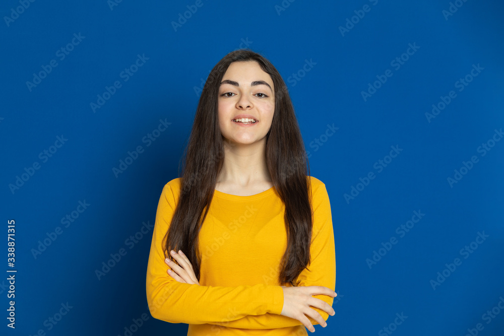 Brunette young girl wearing yellow jersey Brunette young girl wearing yellow jersey