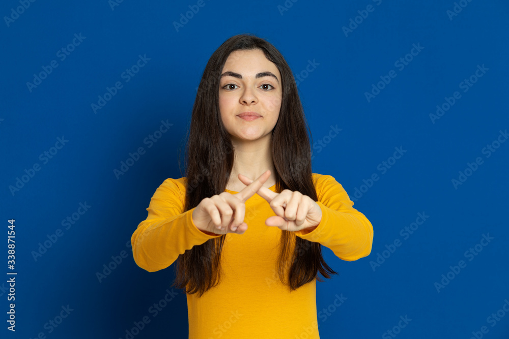 Brunette young girl wearing yellow jersey Brunette young girl wearing yellow jersey