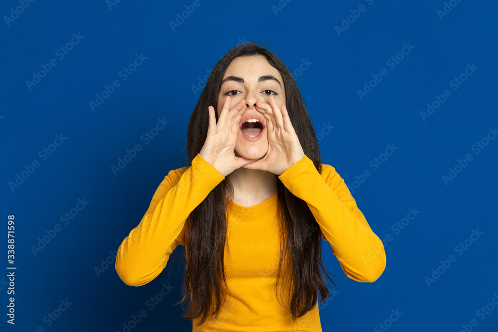 Brunette young girl wearing yellow jersey