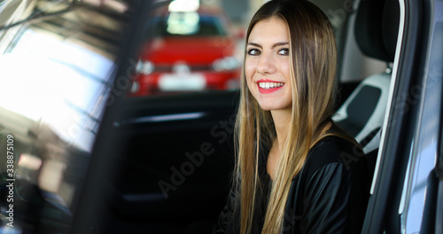 Young woman in her new car smiling © Minerva Studio