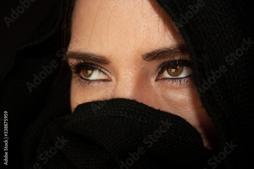 Mexican woman in black turban with big honey eyes
