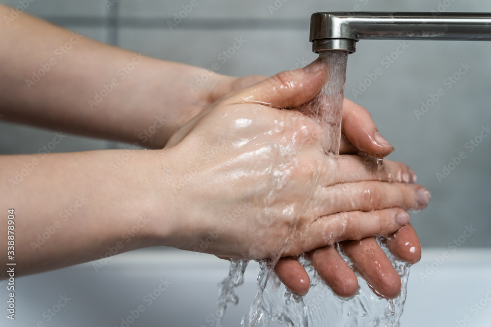 Fototapeta premium Hygiene concept. Woman washing hands close up. Coronavirus Prevention.